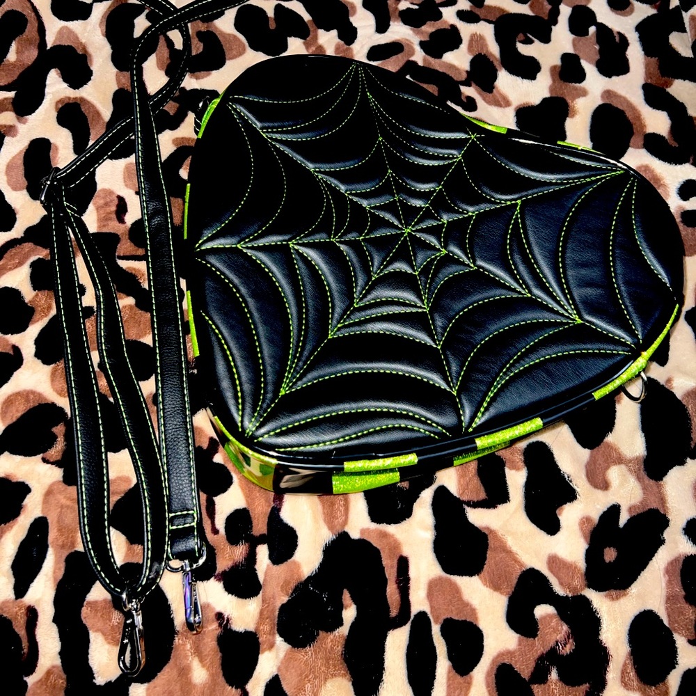 Large crossbody/backpack heart shaped spiderweb bag. Matte black w/ neon green